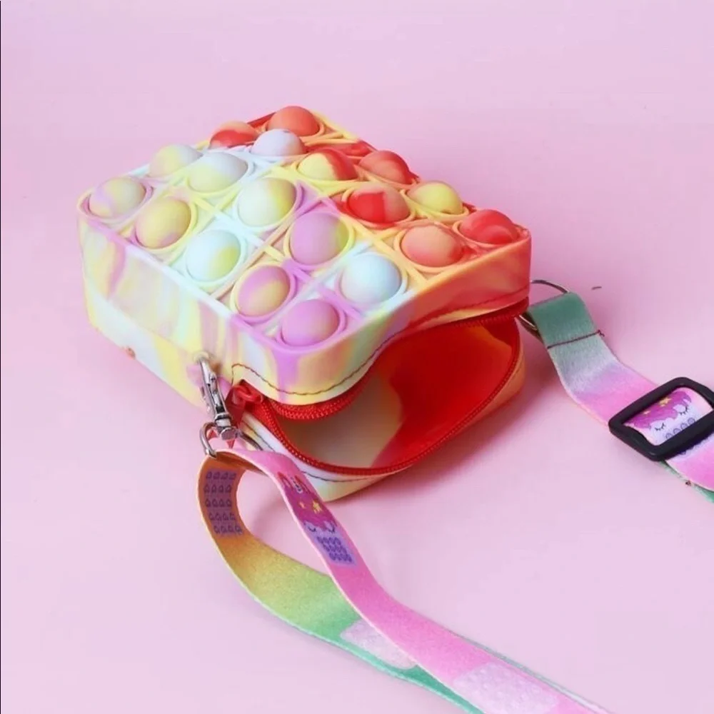 Pop-it crossbody. Tie dye color with adjustable cloth strap.